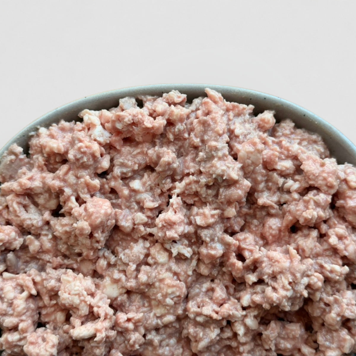 Close up of gently cooked Louis cat food, showing real strands of meat.